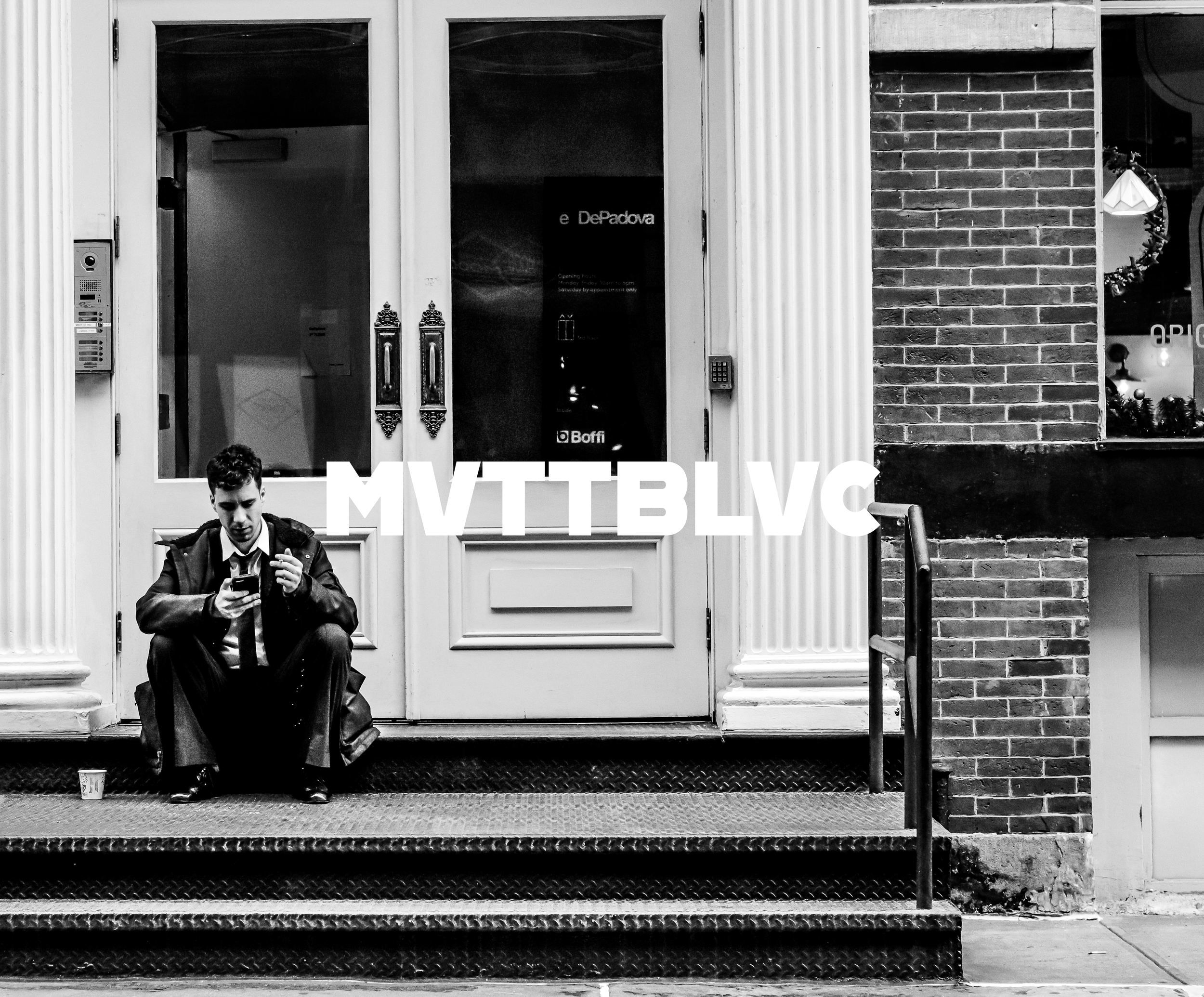 man_smoking_on_steps.png