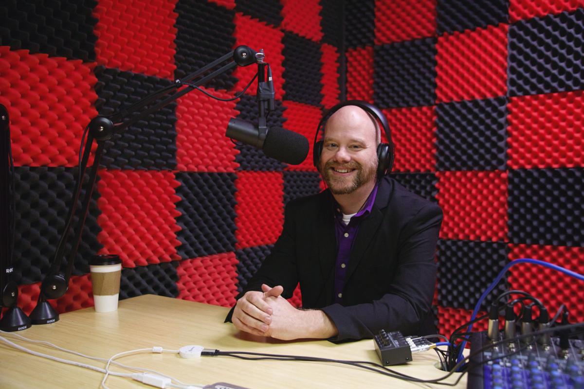 Professor Dan Buck, co-host of podcasts “Project SSA” and “The Punnery,” in his studio. Photo by John David Clark, Photography Editor