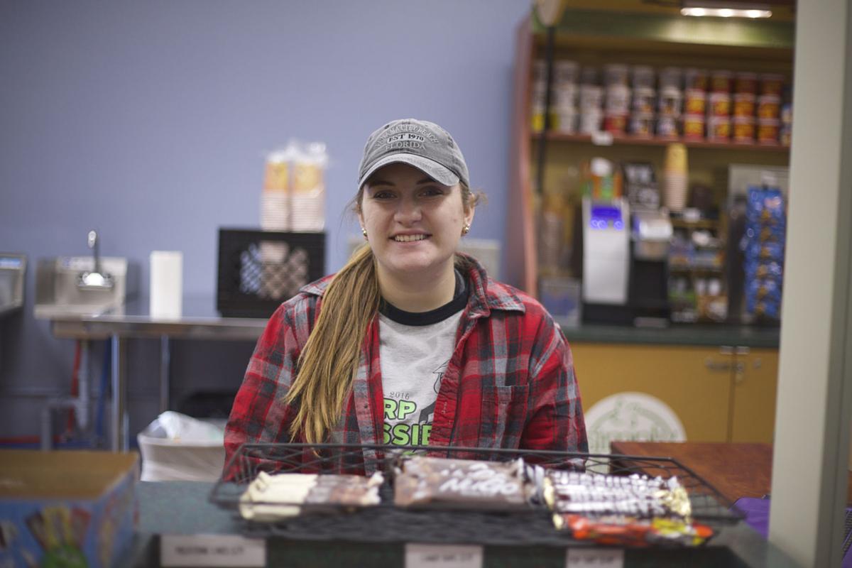 Sherri-Lyn Duncan, working the new cafe at the William G. Squires Library. Photo by John David Clark