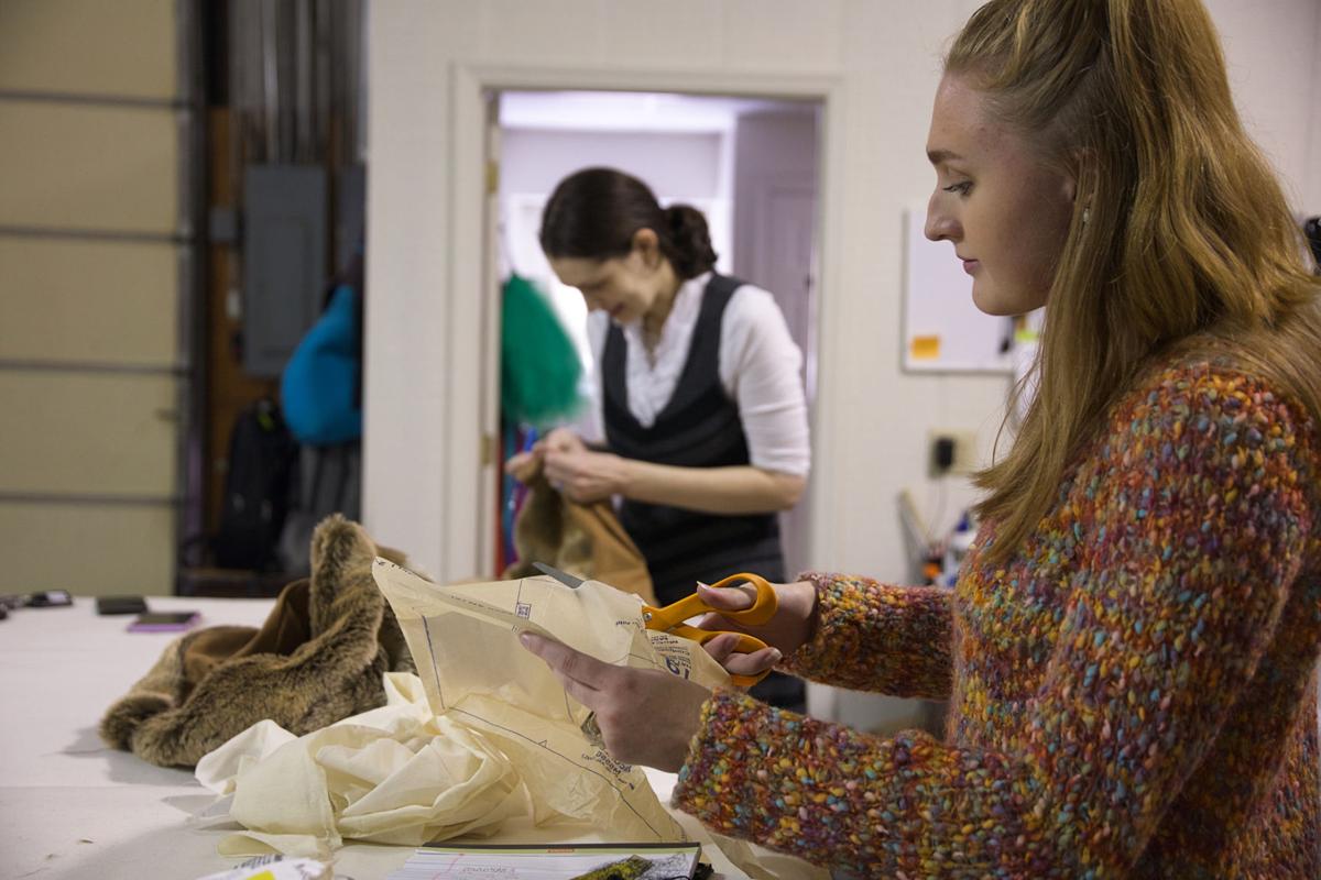 Khristina Scoggins (left) and Macy brown (right) prepare the wardrobe for an upcoming theatre production at Lee University. Photo by John David Clark