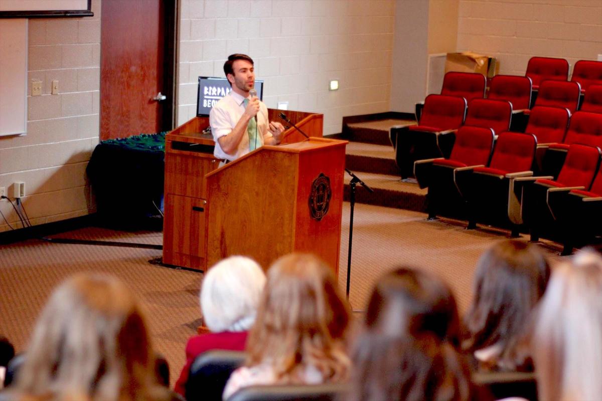 Hunter White, an English major, presents his research on the Christian aspects of the epic “Beowulf.” Courtesy of Ben Absher