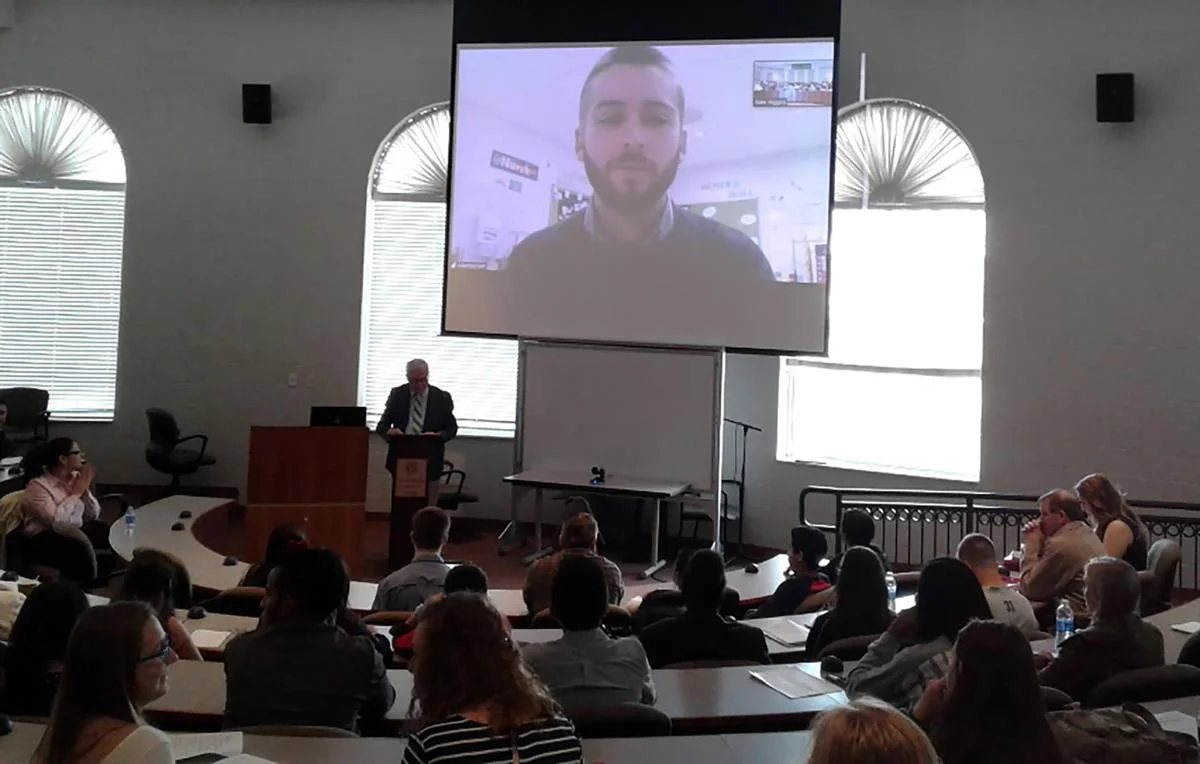 Conference attendees listen to Robert Bennett’s presentation via Skype. Photo courtesy of the Lee University Public Relations office