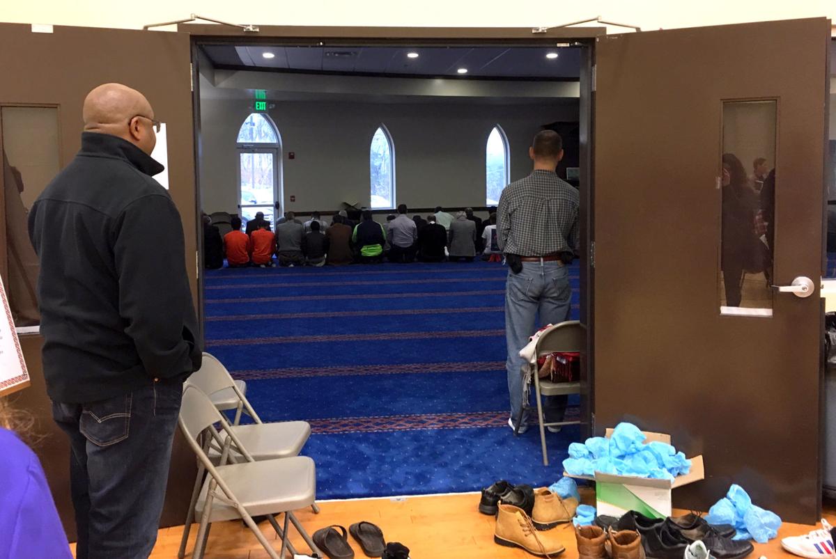 Bystanders observe a Muslim prayer service at the ISGC. Photo by Kimberly Sebring, News Editor