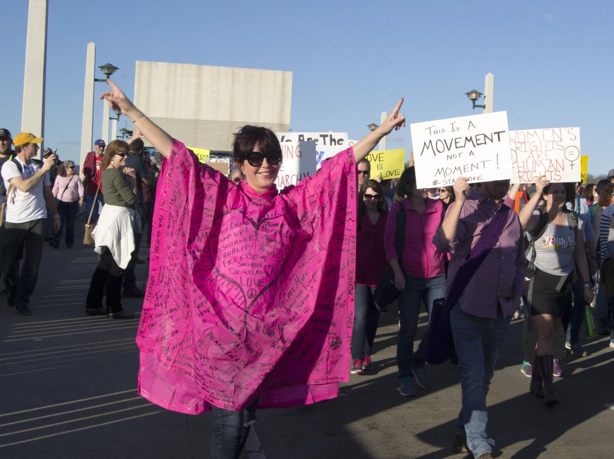 A protestor demonstrates her support for women's rights on Market Street Bridge in Chattanooga on Saturday, Jan. 21. Photo by Kimberly Sebring