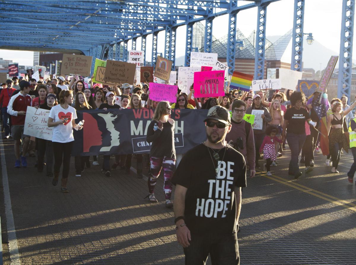 Protestors cross Market Street Bridge in Chattanooga during a women's march on Saturday, Jan. 21. Photo by Kimberly Sebring