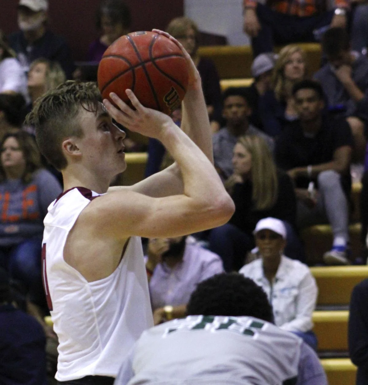 Sophomore Cody Jones takes a shot during a Flames basketball game. photo by Alex Farmer