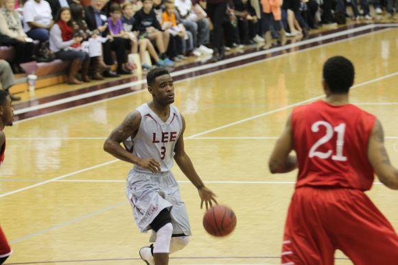 Sophomore guard Stedmond Ford carries the ball down the court.Photo by Neethu Athimattathil