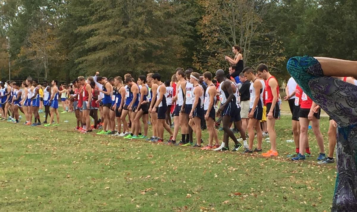 The men's Cross Country team lines up before a race. Photo by Alex Farmer