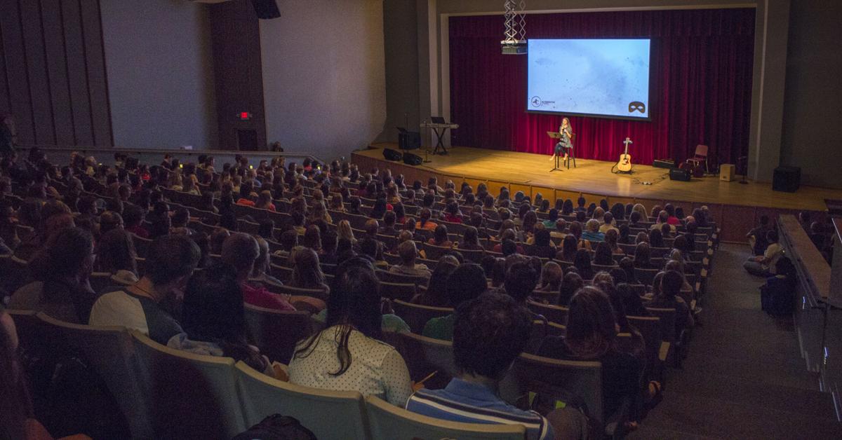 The Dixon Center can seat 591 people, but has been filling up by 10:30am on Tuesdays and Thursdays. On the right, some students can be seen sitting on the floor during service. Photo by Mitchell Hartley