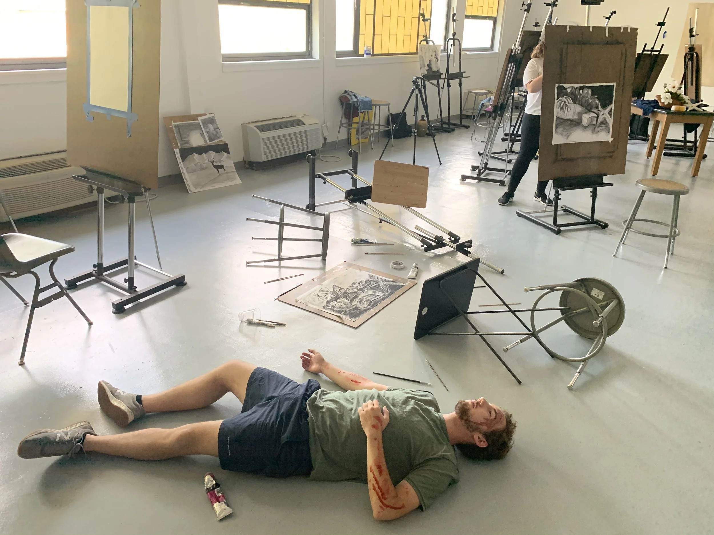 Sophomore cinema major Nate Richardson poses as an unconscious body for Team Holt’s film. Photo courtesy of Lily Scott.