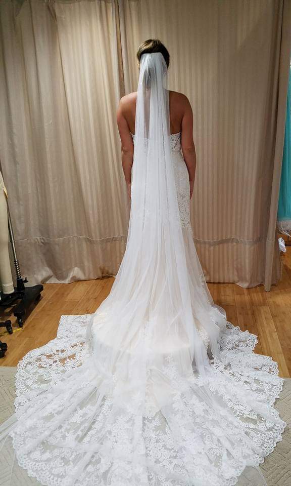  Final fitting at studio - we removed the beautiful scalloped lace at the hemline &amp; reattached after it was shortened; the bodice was taken in.  Custom cathedral veil 