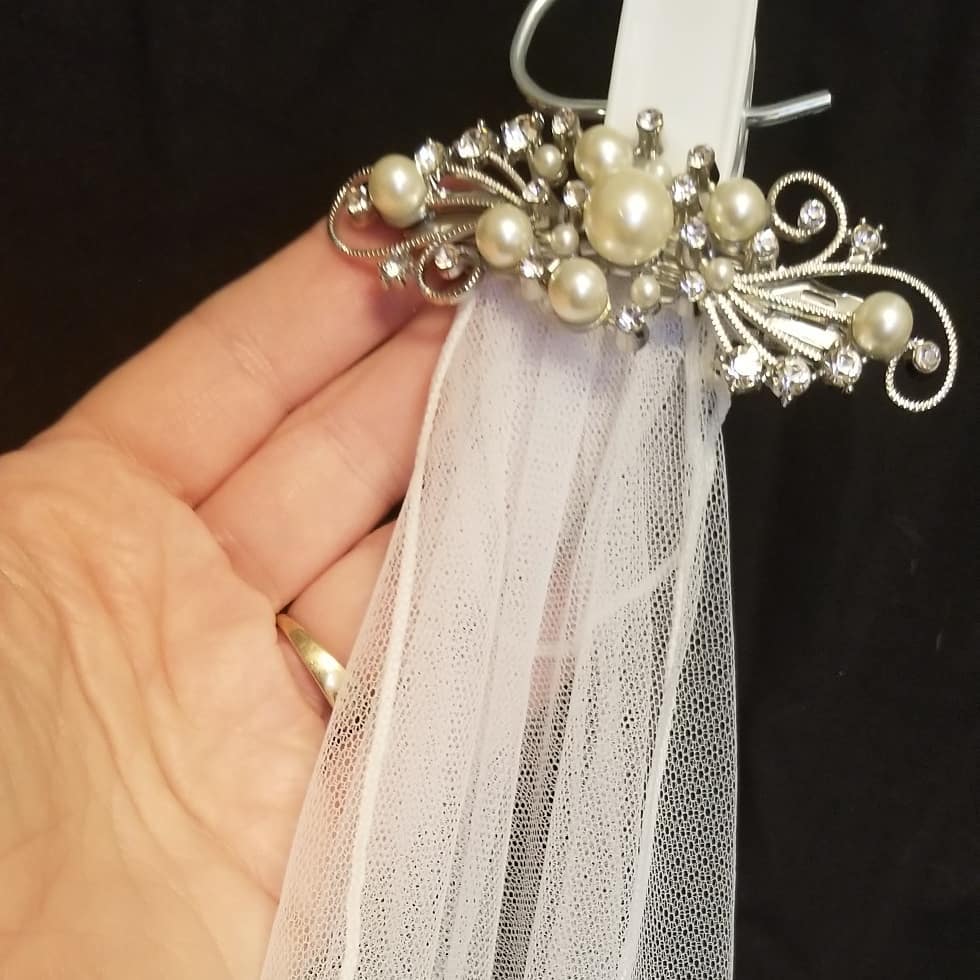  Custom veil attached to embellished hair pin 