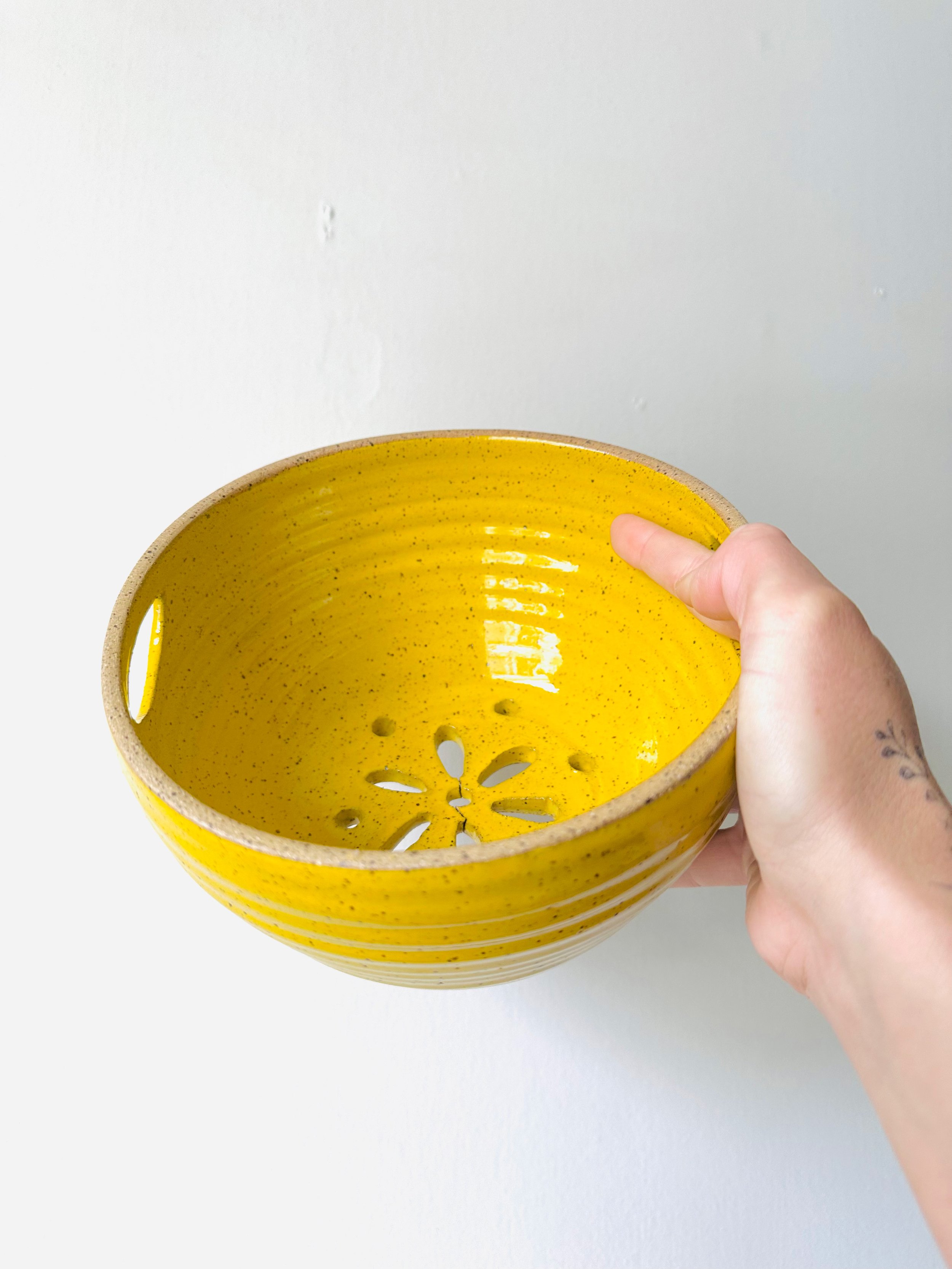 Front-View-of-Handmade-Ceramic-Yellow-Strainer-Bowl.jpg