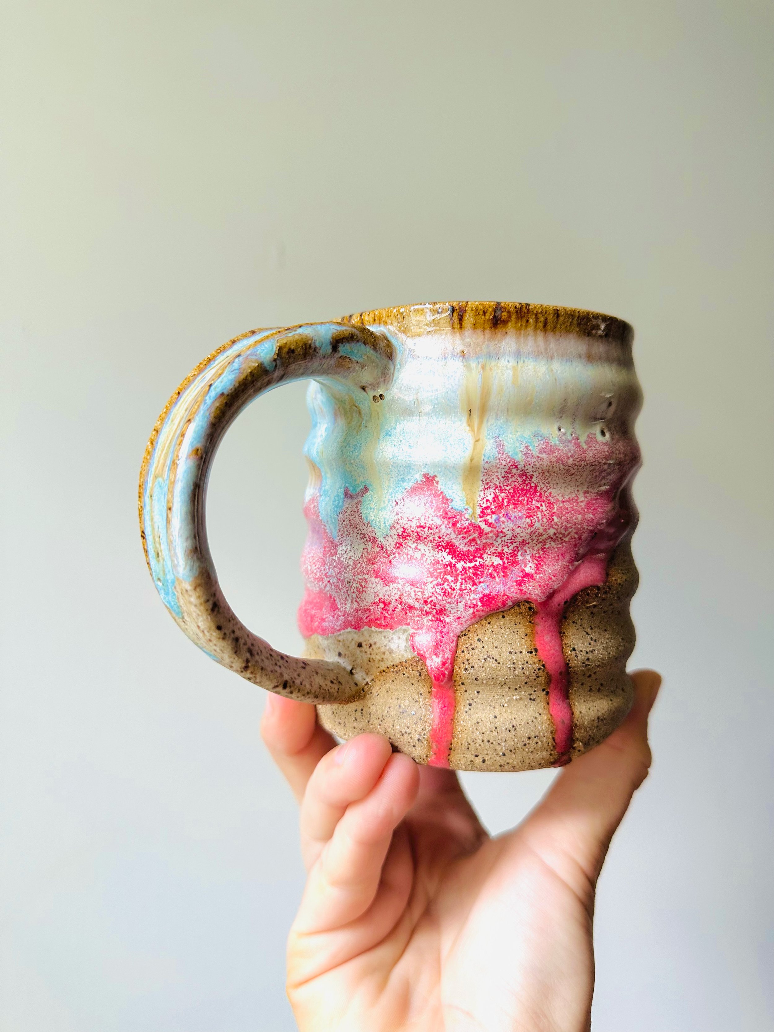 Handle-View-of-Pink-Blue-Dripping-Glaze-on-Handmade-Ceramic-Mug.jpg