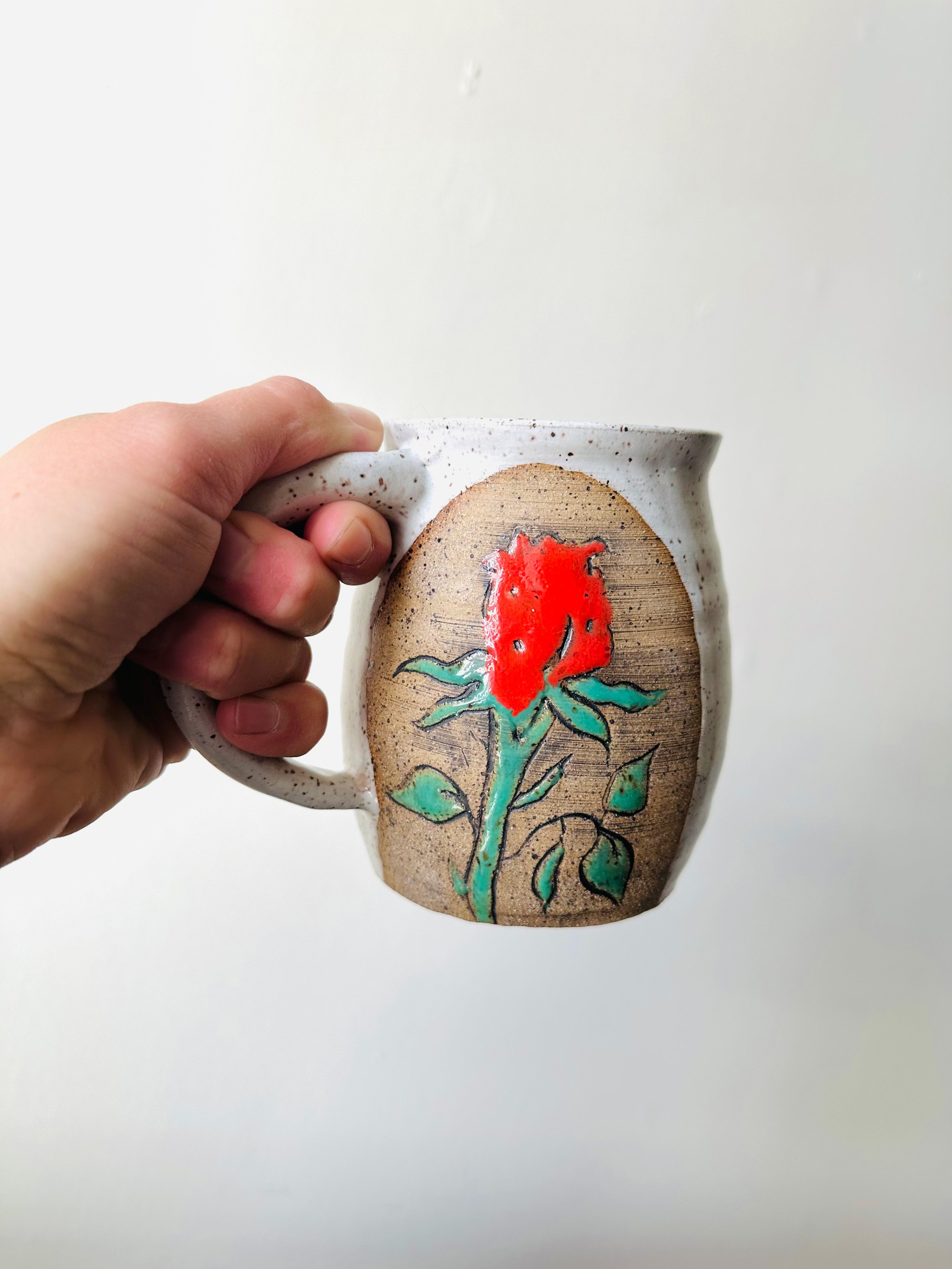 Close-View-of-Handmade-Mug-with-a-Rose-On-It.jpg
