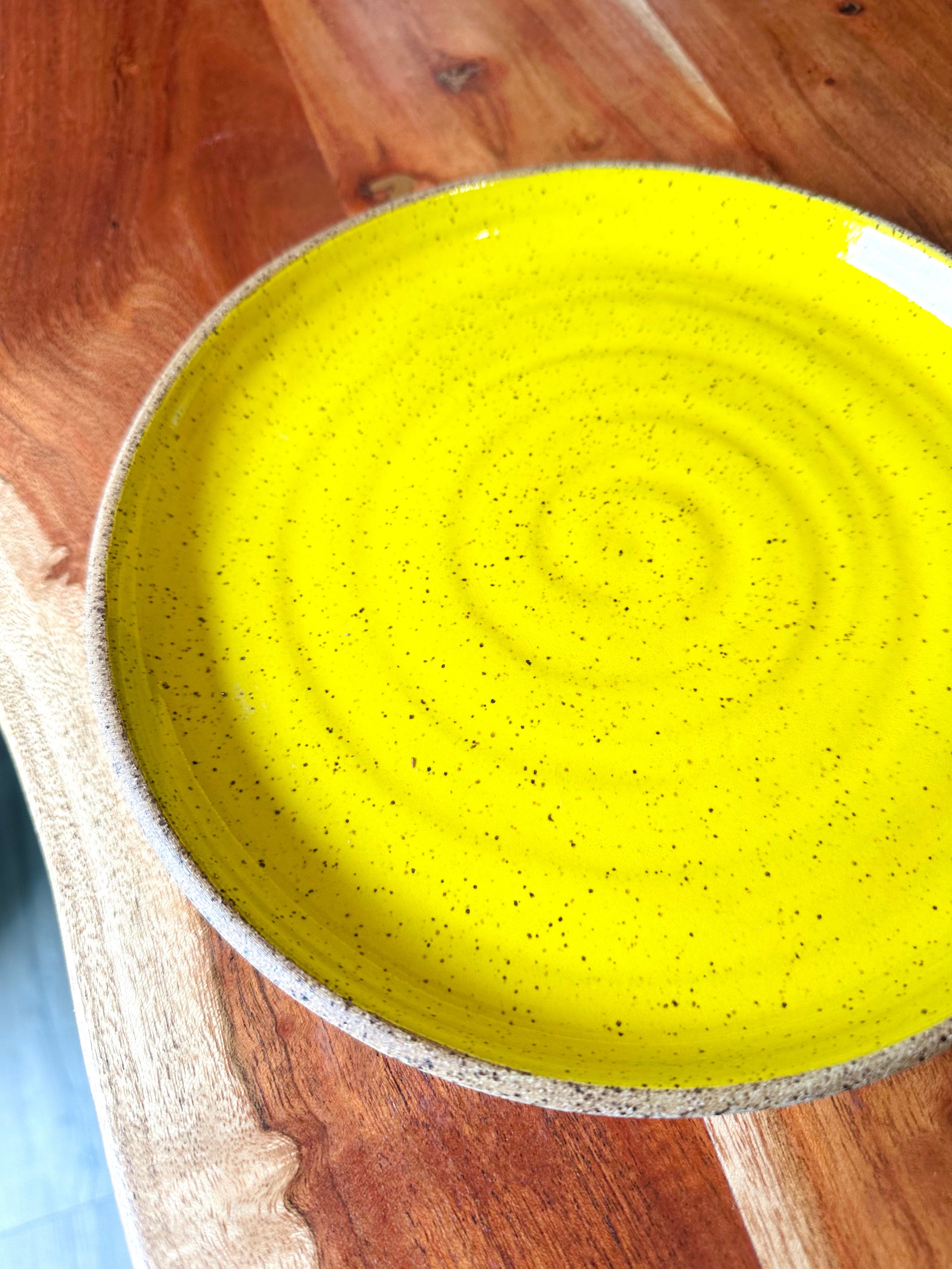 Close-Up-View-of-Handmade-Speckled-Yellow-Plate.jpg