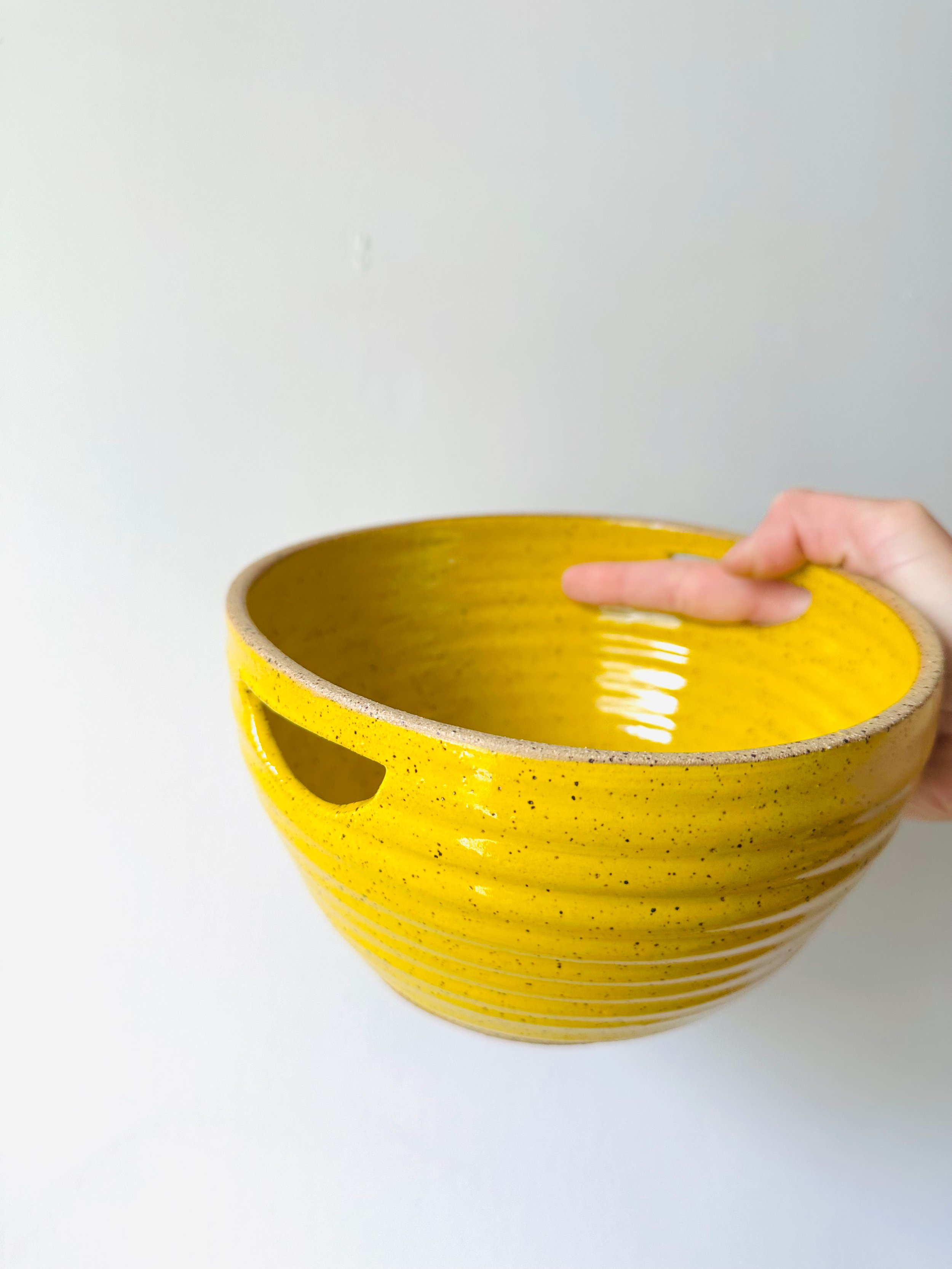 Side-View-of-Handmade-Ceramic-Yellow-Strainer-Bowl.jpg