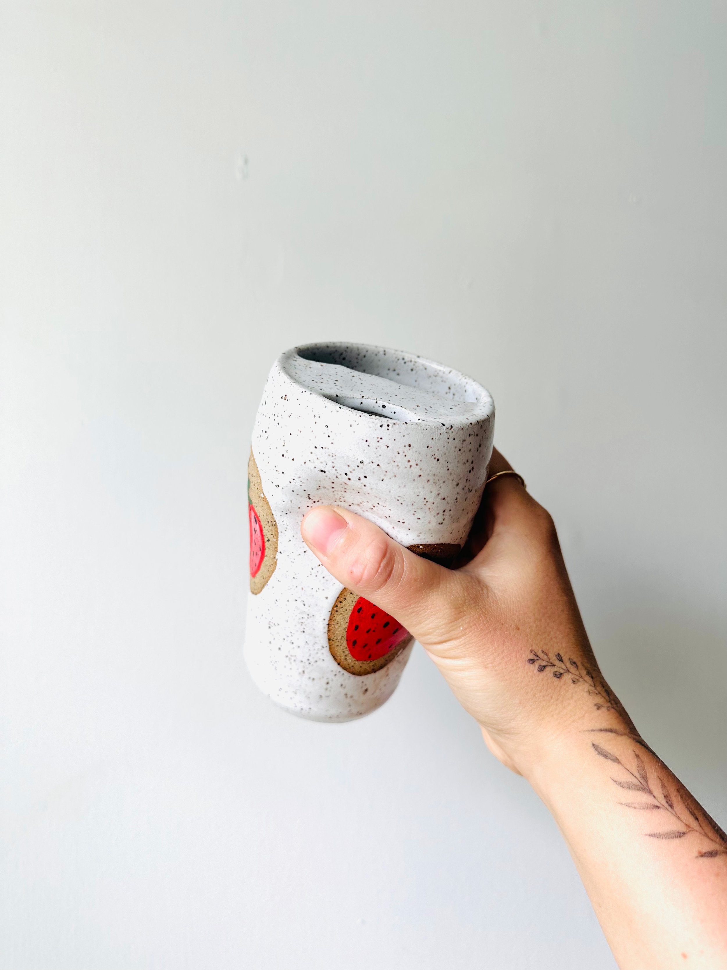 Holding-View-Handmade-Strawberry-Patterned-Thumbprint-Travel-Coffee-Tumbler.jpg