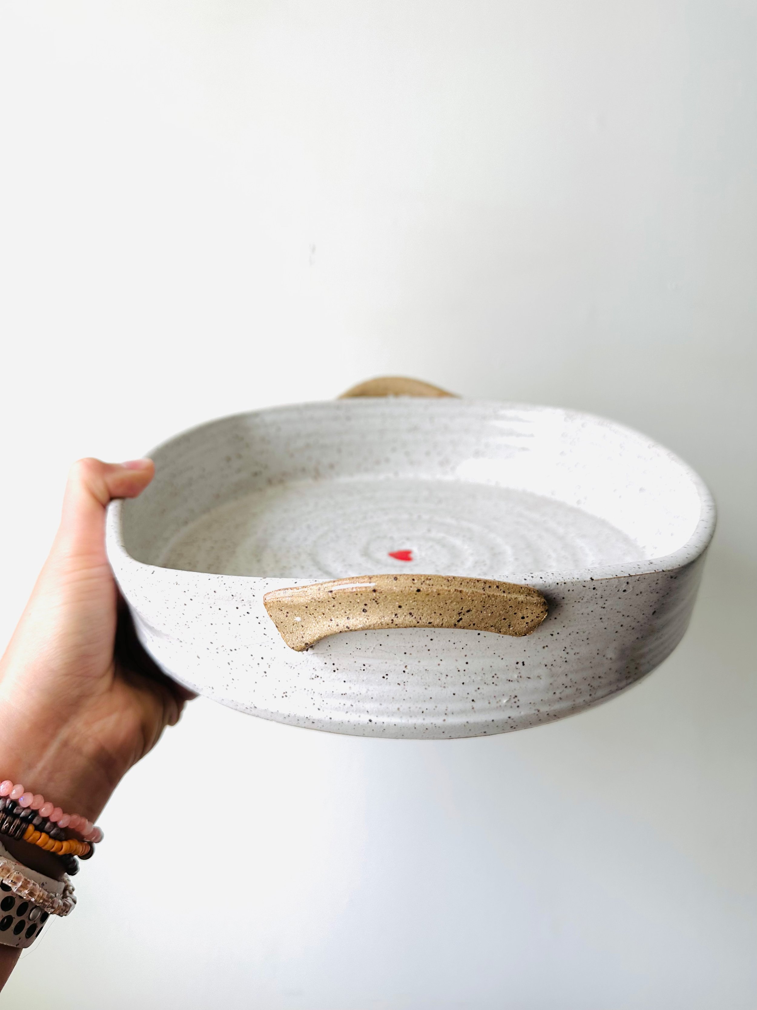 Handle-View-Handmade-Ceramic-White-Casserole-Dish-with-Small-Red-Heart.jpg