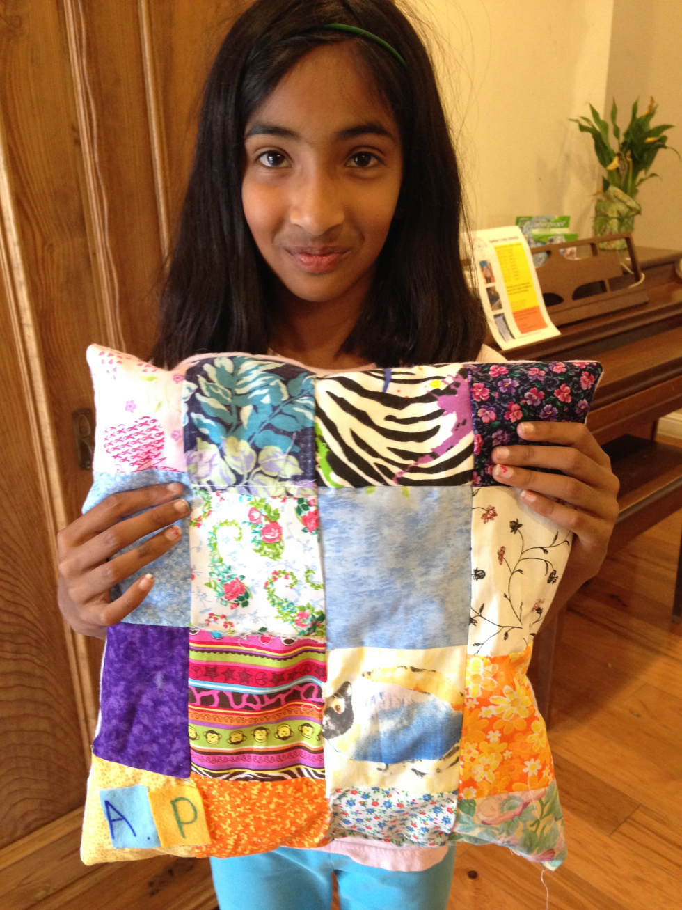  Finished pieced quilted pillow by 3rd grader. 