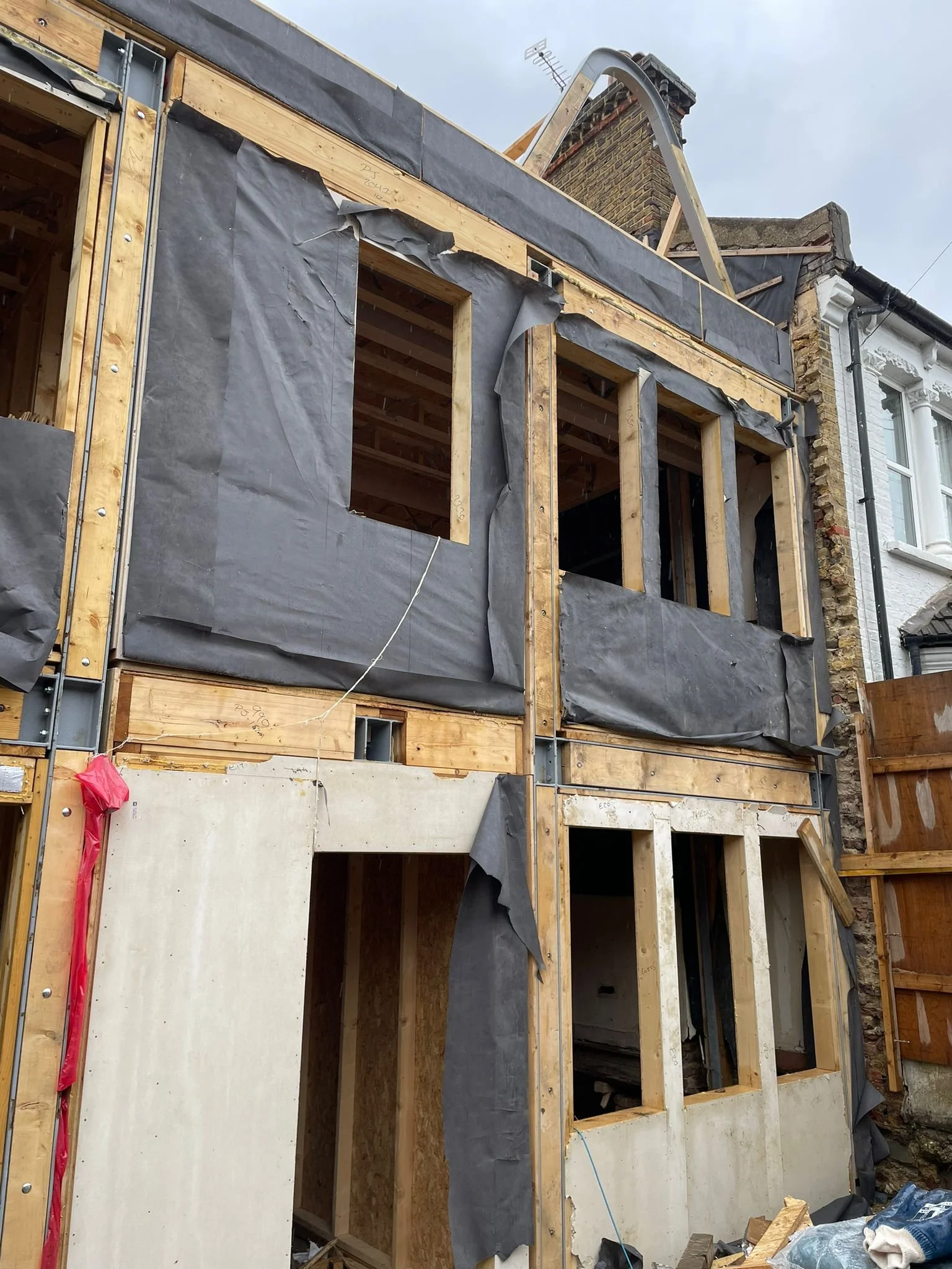 Timber frame construction and waterproof membrane prepared prior to brick slip cladding installation