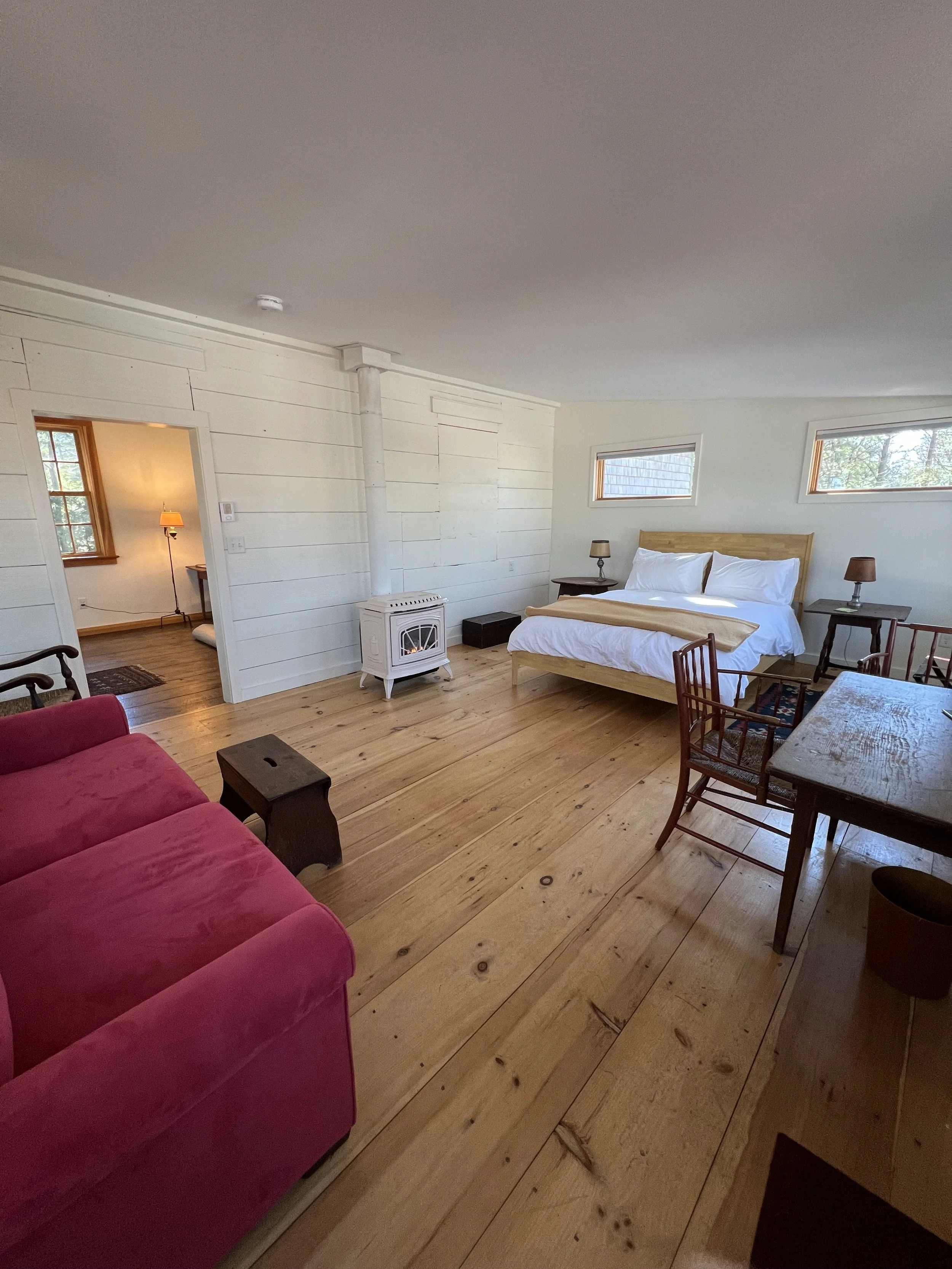 Cozy bedroom with queen bed inside New Salem MA cabin rental