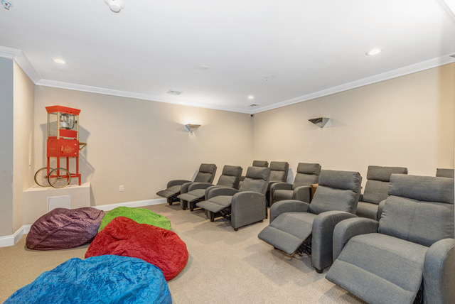 Theater room with lazy boy chairs for seniors watching movies