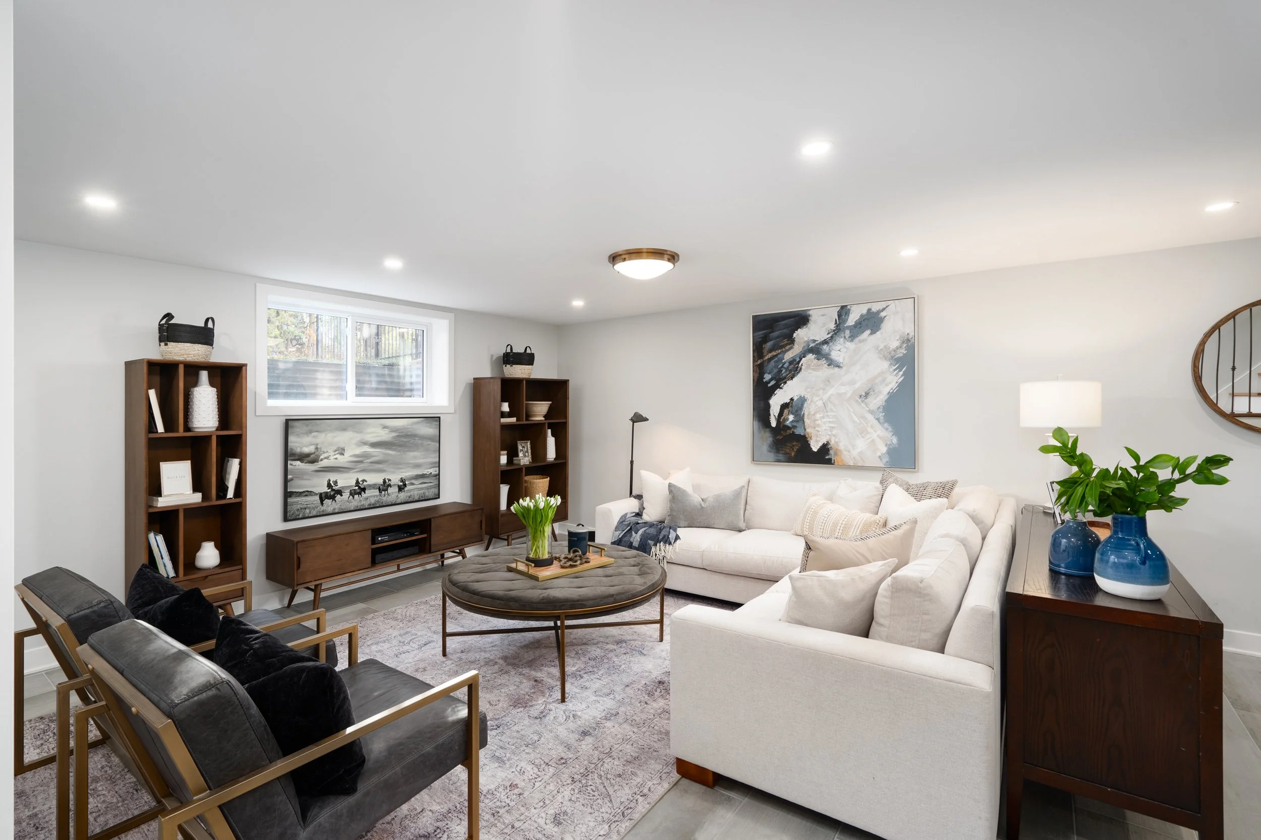 Linden House Living Room Renovation with Cream Sectional & Walnut Bookcases