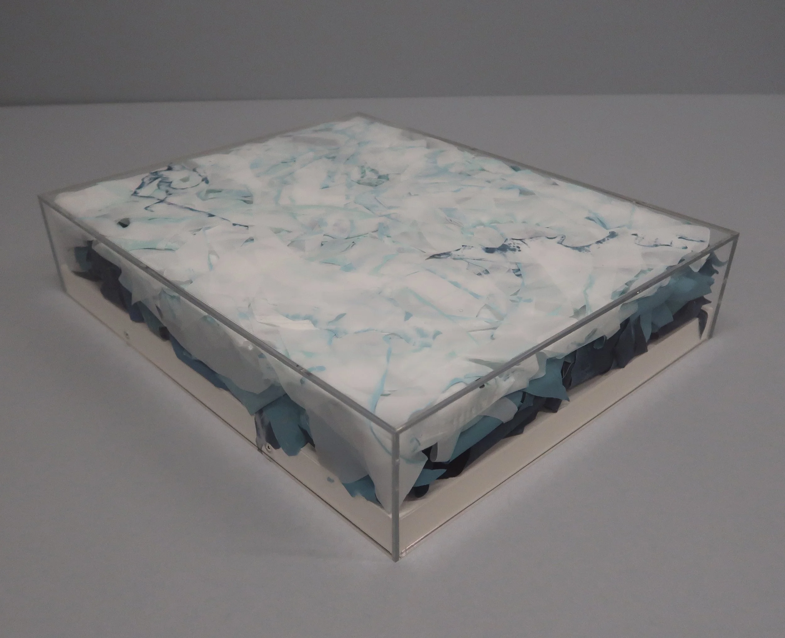    untitled (stamukhi II)  , 2025, Recycled Plexiglass Vitrine, Recycled Film Projection Screen, Recycled Interior House Paint, 3.4375 × 16.3125 × 13.125” 