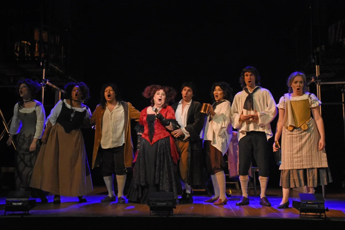 Mistress Revels (J. Shaulis) and revelers at the tavern - Photo by Tina Buckman
