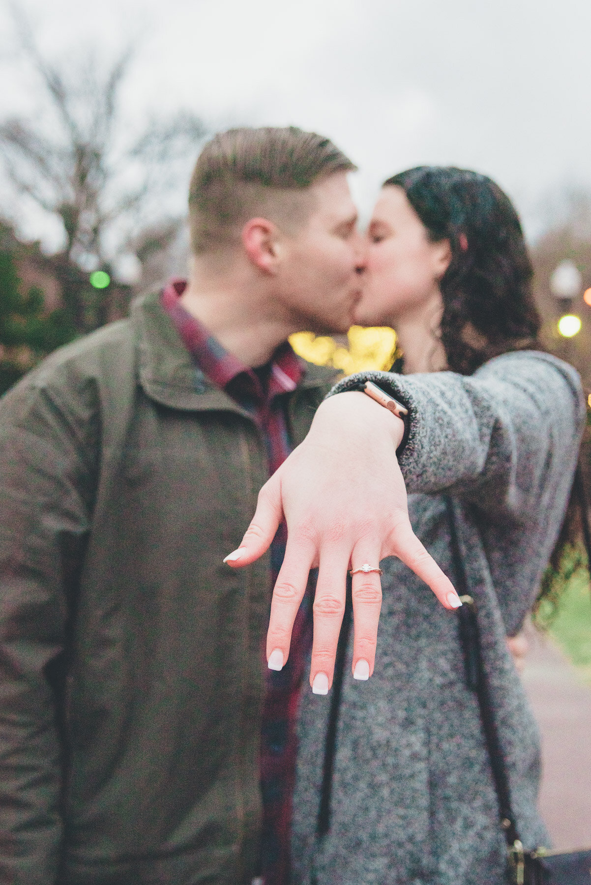 rhode island proposal photographer fiance kissing each other after he proposed in Boston Common in the spring