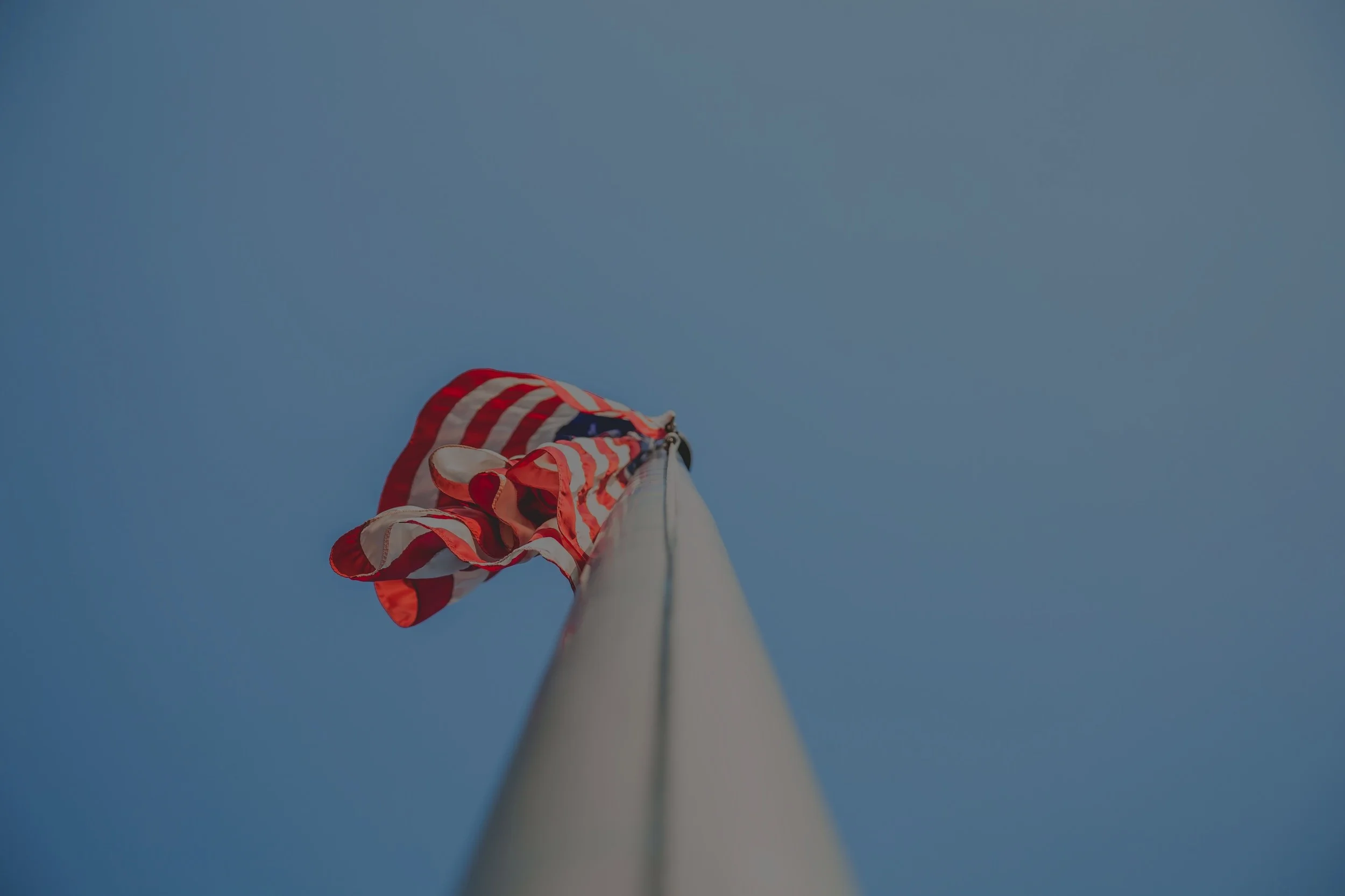 american-flag-blue-sky-blur-1582520.jpg
