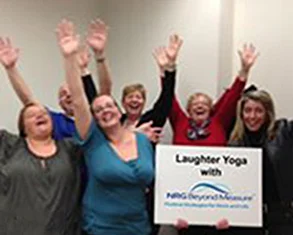 Assured Healthcare Staff enjoying Laughter Yoga.