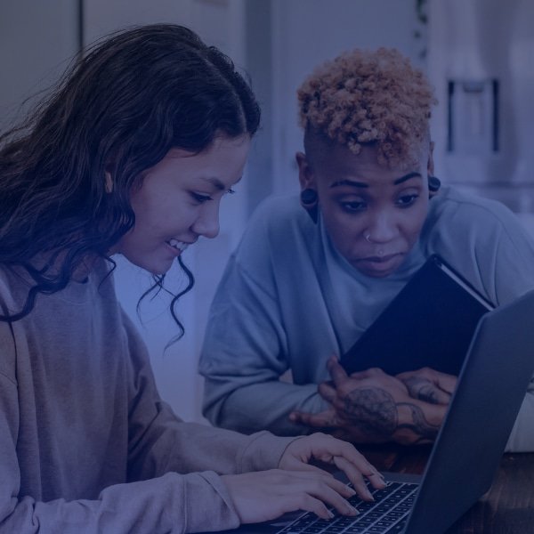 Employees looking at guide to workplace wellness