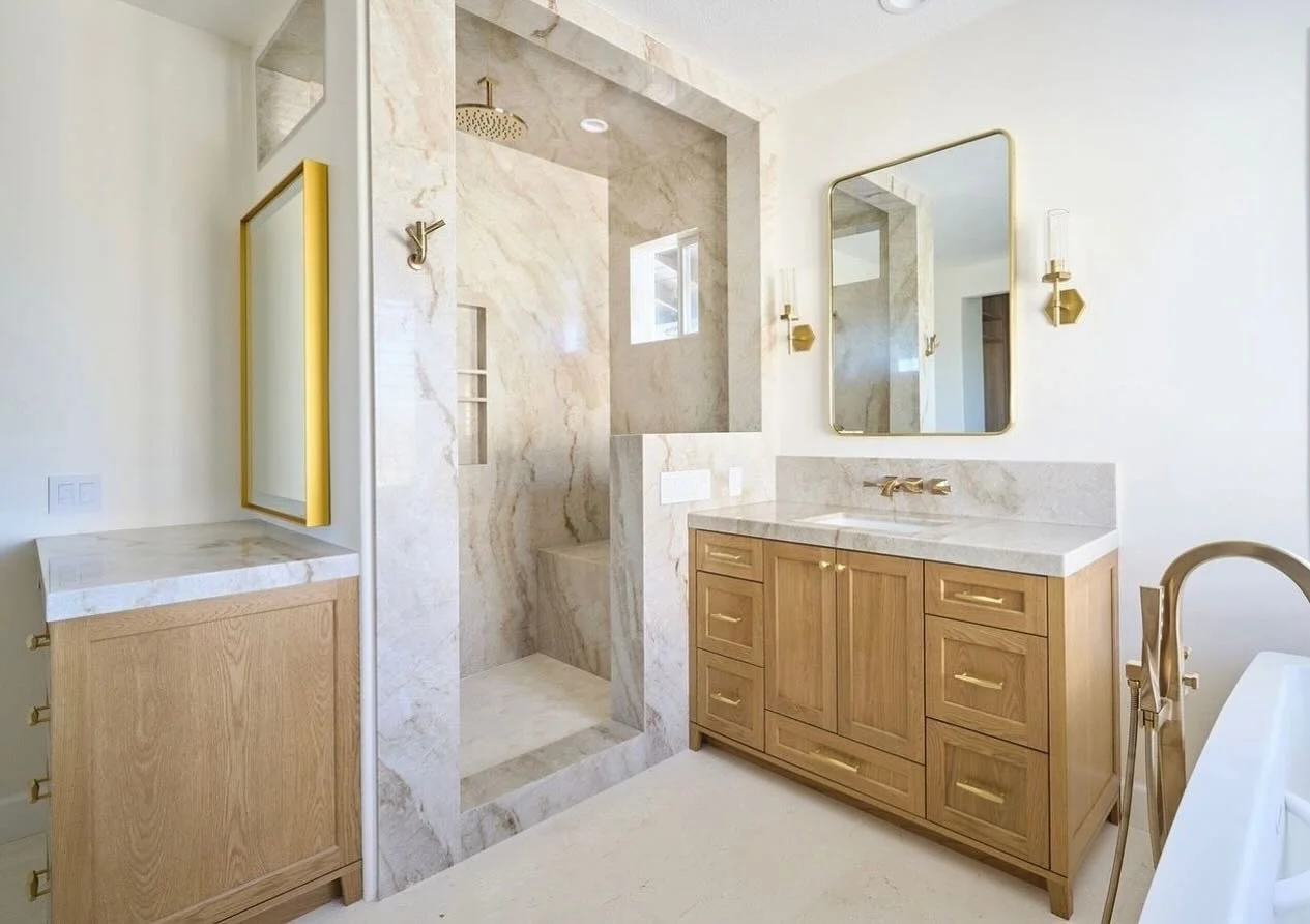 Wood bathroom vanity with paneled doors and storage drawers