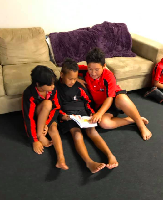 Helping my friends with their Reading.