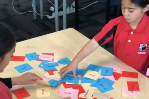 Learning sight words with a friend.