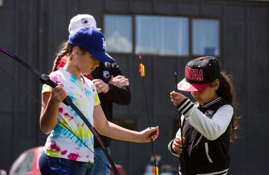 Giving archery a go up at camp.