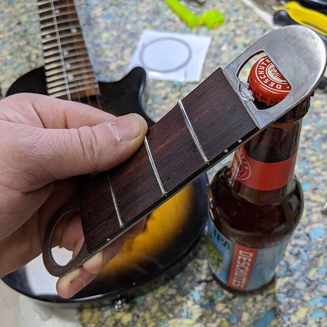 How to restring your guitar the right way: 
1. Open beer with Fretnot
2. Change strings on guitar
3. Enjoy happiness