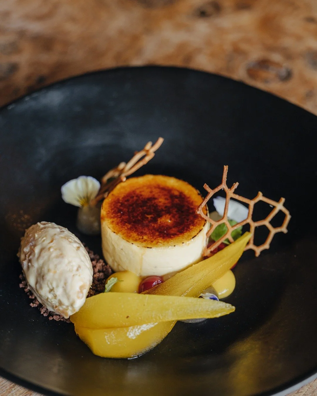 Tonka Bean Creme Br&ucirc;l&eacute;e, Saffron &amp; Orange Poached Pears, Rum &amp; Raisin Ice Cream, Pear Pur&eacute;e 

Desserts at The Wildebeest
www.thewildebeest.co.uk