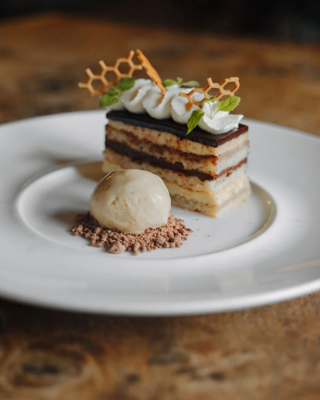 Opera Cake is a classic French dessert made from layers of joconde sponge, coffee buttercream, and chocolate ganache.

Our pastry section painstakingly prepares desserts from scratch.
www.thewildebeest.co.uk