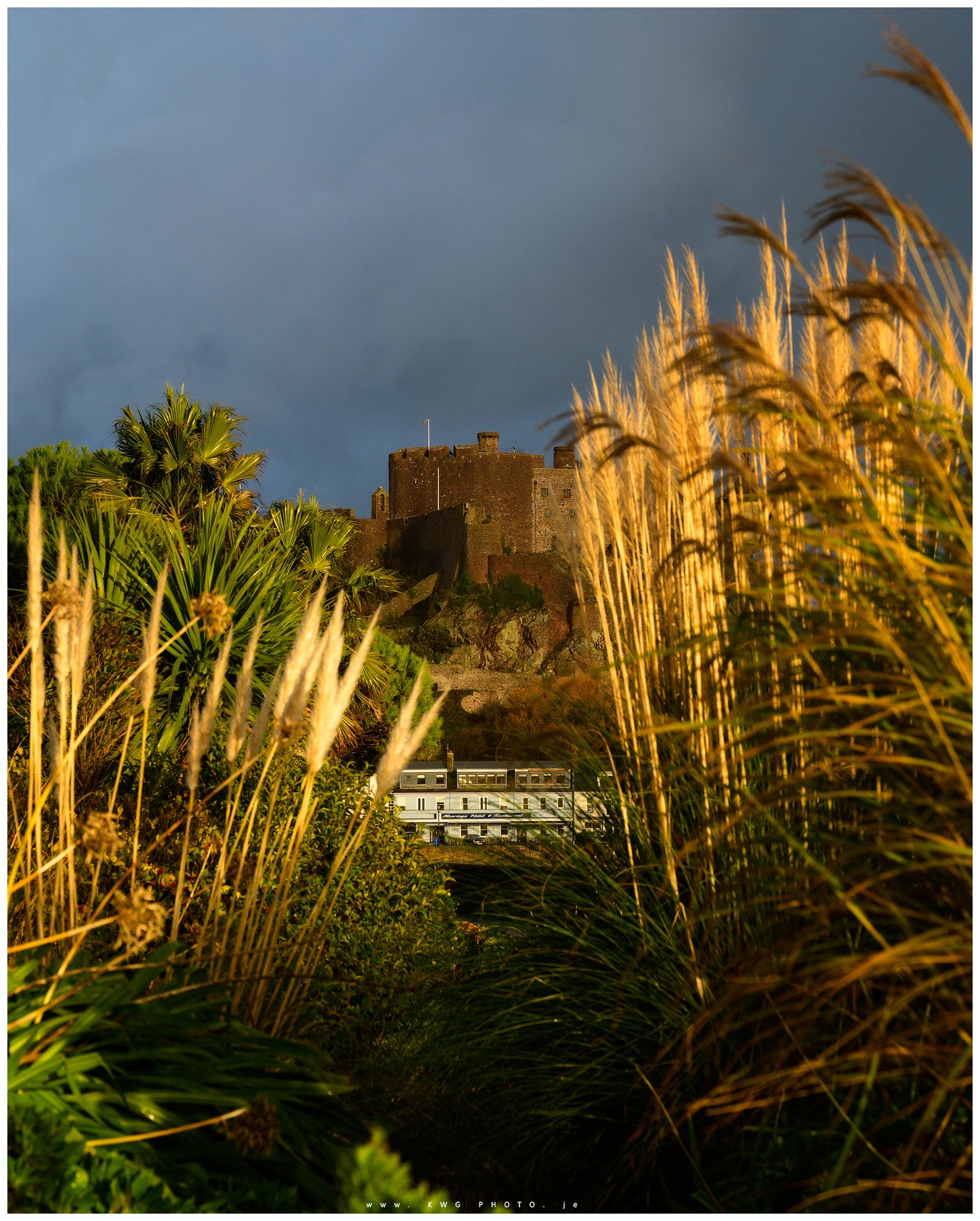 Mont Orgueil Castle with Moorings Hotel viewed from the promenade 
