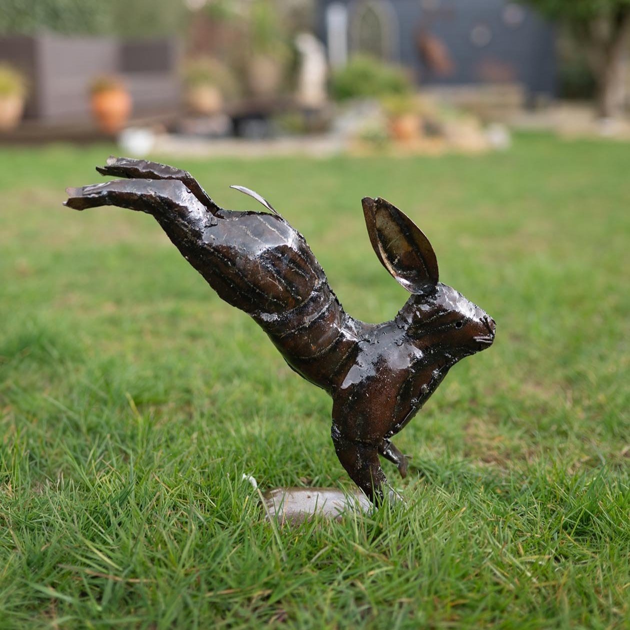 Recycled metal bounding hare garden ornament