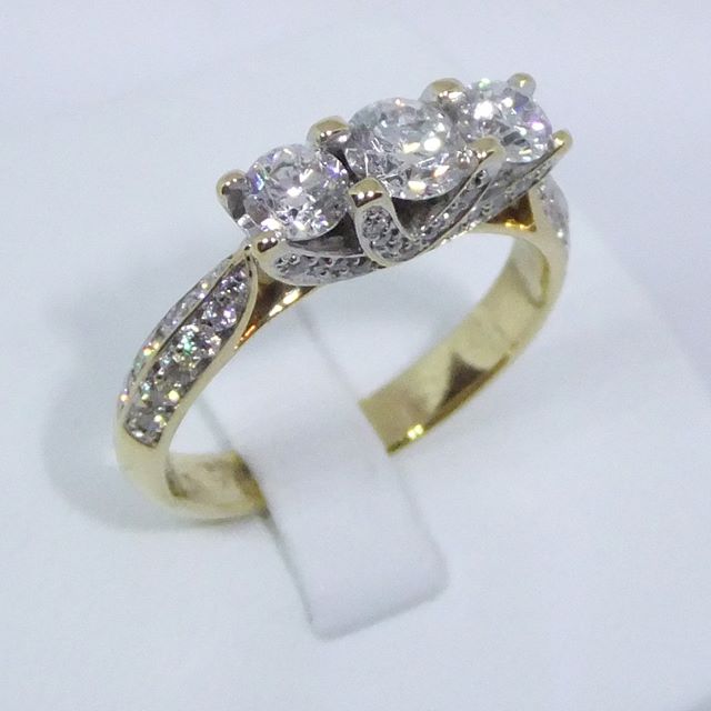 Here it is again with a bit more sparkle. 18ct yellow gold 1.25ct 3 stone diamond with stones on the shoulder. &pound;1500.