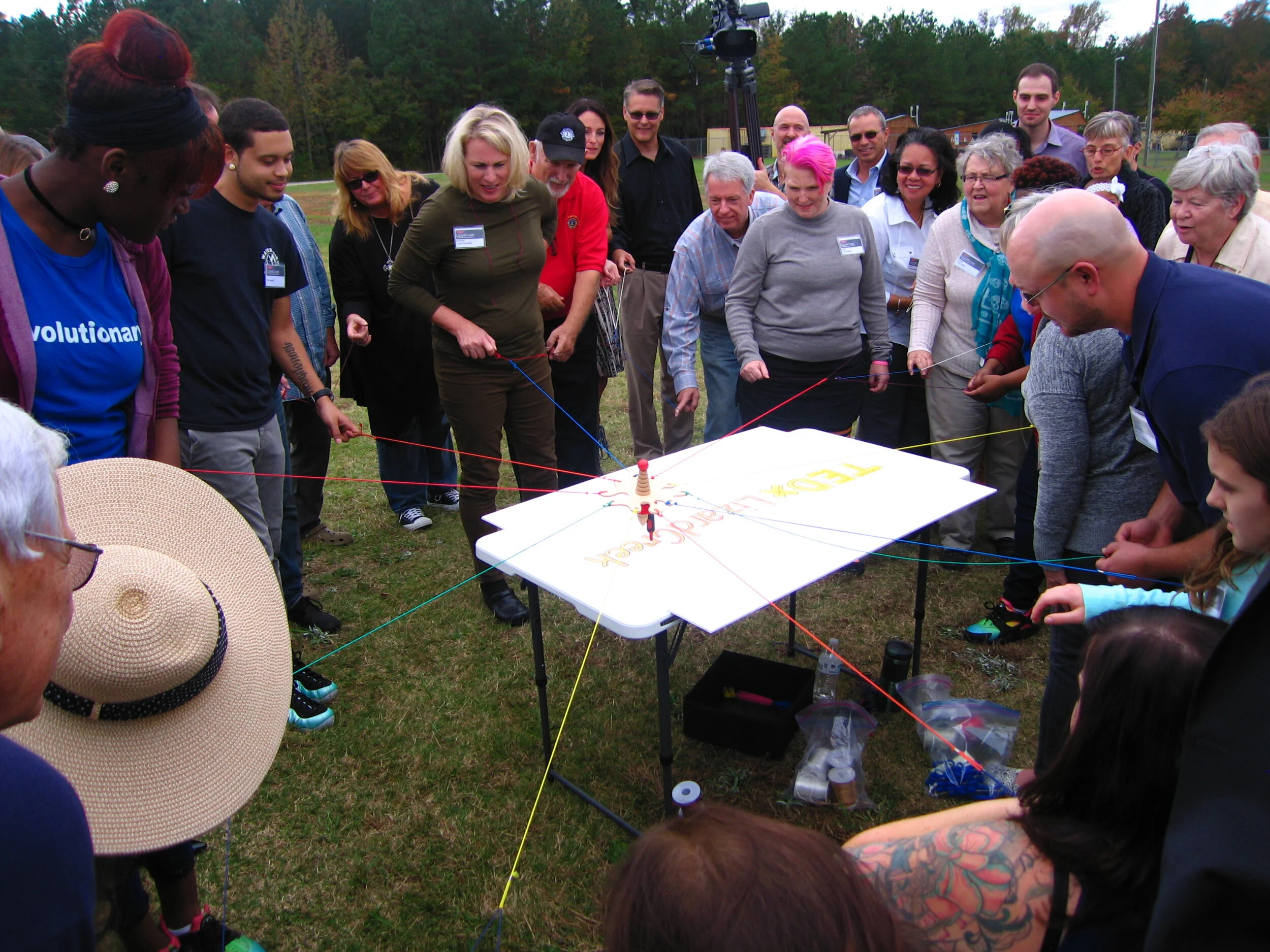 80 people write with one marker for a Lizard Brain visual energizer
