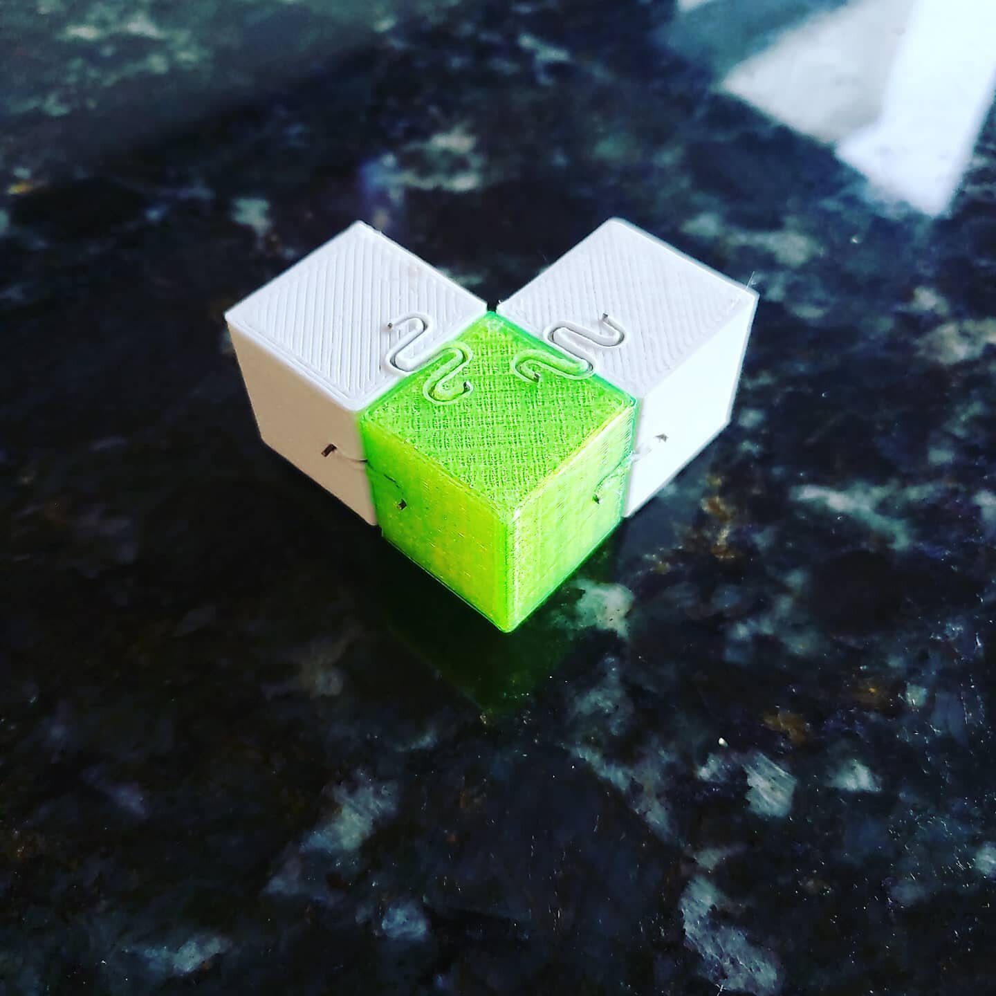 We are currently testing many different ways of joining 3d prints. Our newest machine that arrived today looks to be faster and stronger than epoxy on these calibration cubes.