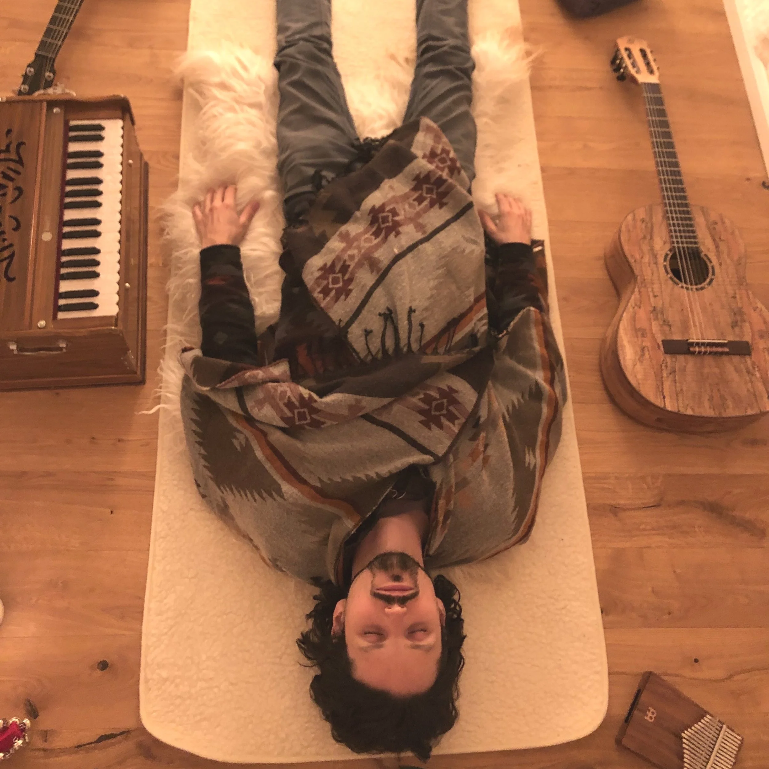 Martin Rothe Musician lying down in Savasana after playing music