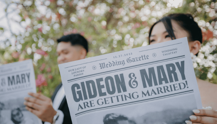 Couple revealing their engagement with a personalized newspaper announcement