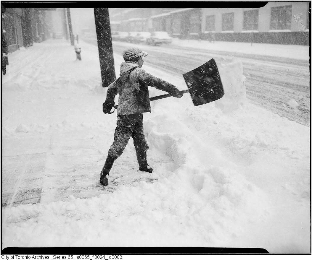Young boy shovels snow after 1944 snowstorm (Copy)