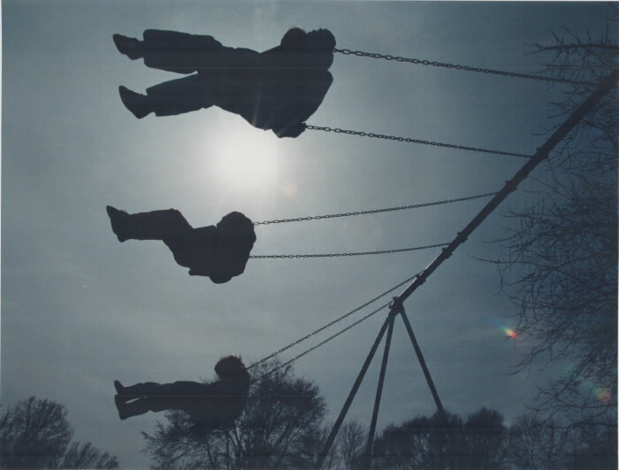 Children silhouetted on swing set - Toronto Star, 1996 (Copy)